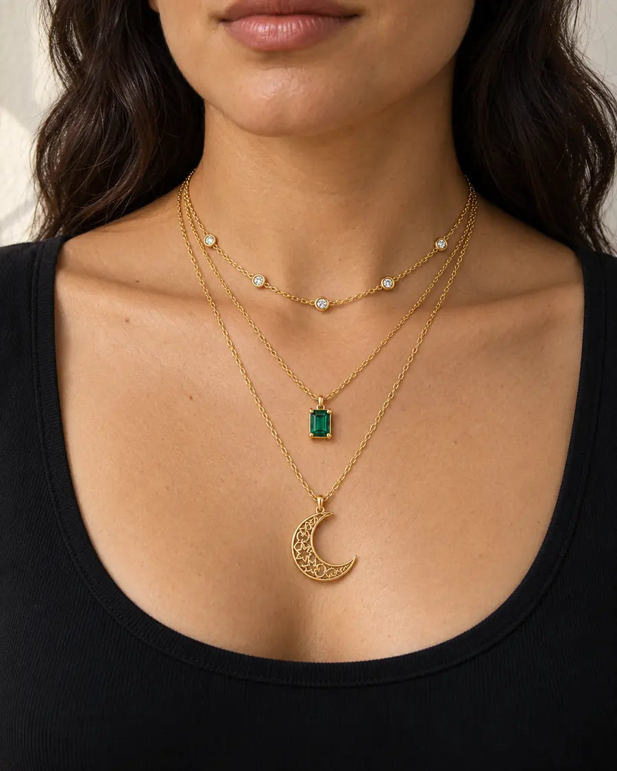 The three Moonlight necklace layers worn with a simple black top