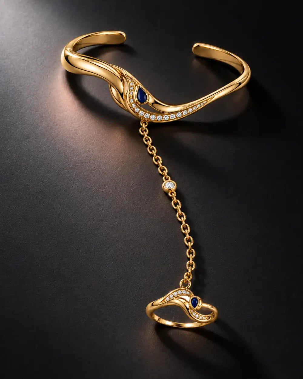 The Golden Ink Hand Chain on a charcoal background